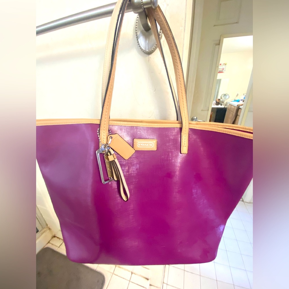Gorgeous Coach tote! It is a soft, powdery purple color in EUC.